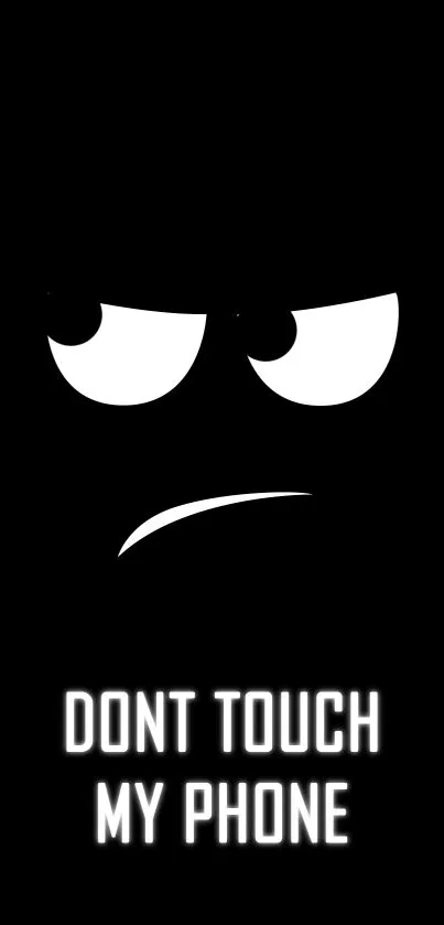 Dark theme wallpaper with expressive face saying don't touch my phone.