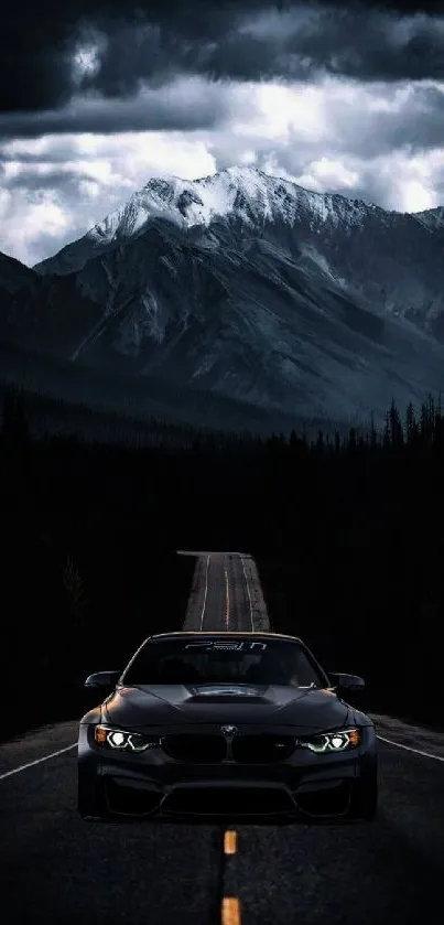 Sleek black car on mountain road wallpaper.