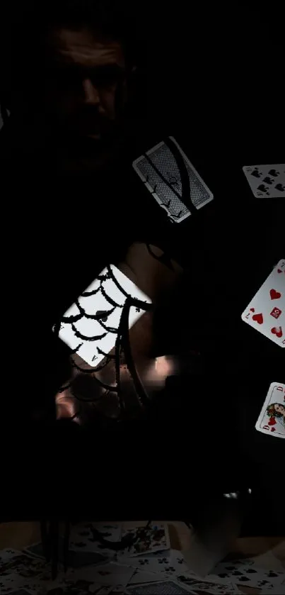 Dark artistic wallpaper with cards and web motifs on black background.