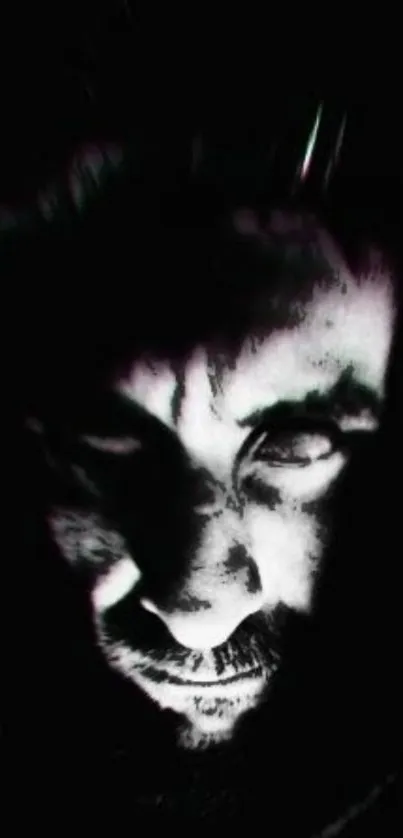 Mysterious dark face in shadowed light.