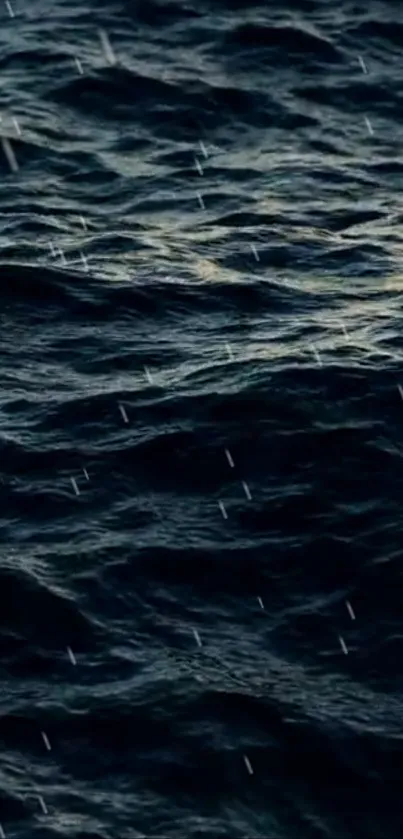 Dark ocean waves with rain falling, creating a serene scene.