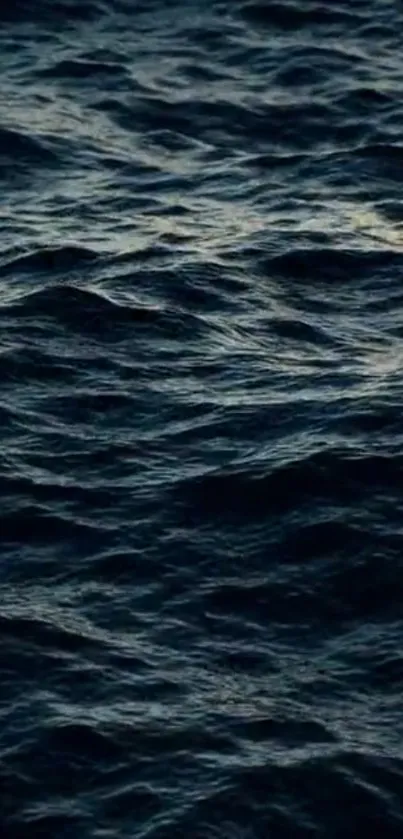 Dark waves forming a textured pattern on the ocean surface.