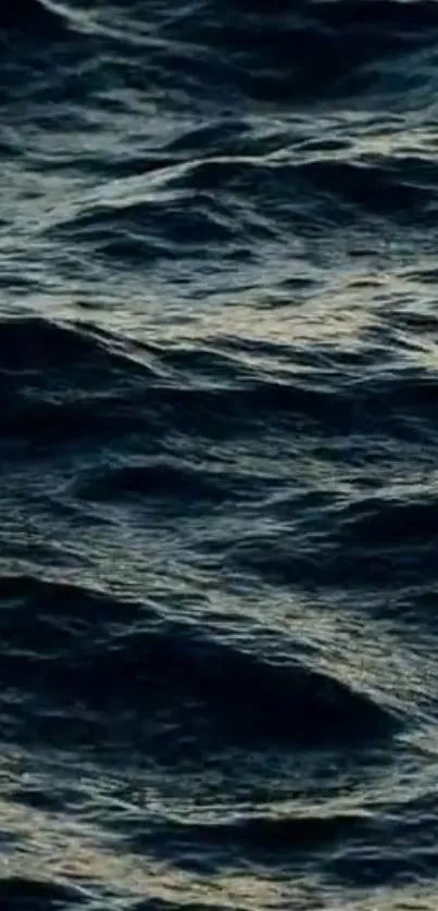 Dark blue ocean waves creating a serene and mysterious atmosphere.