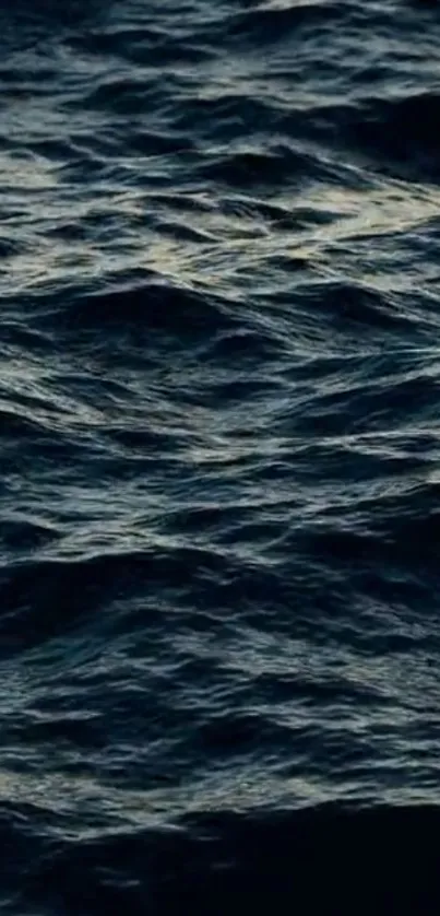 Dark ocean waves create a serene mobile wallpaper scene.
