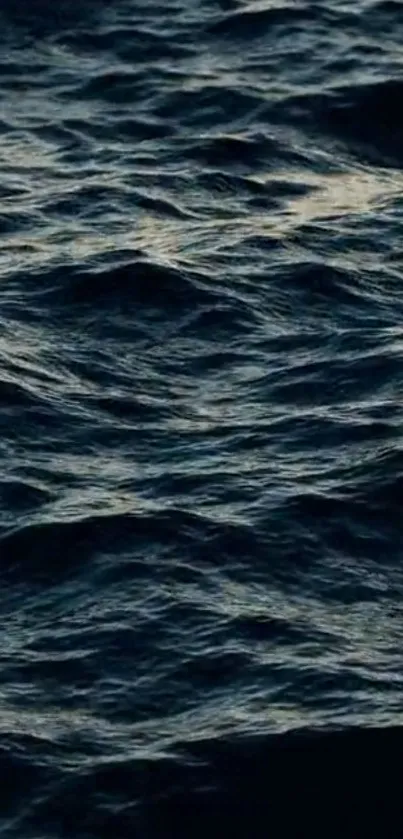 Dark ocean waves create a calming and mysterious mobile wallpaper background.