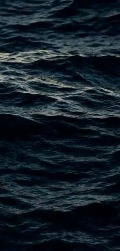 Dark ocean waves create a calming mobile wallpaper background.