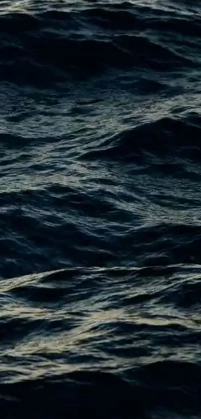 Dark ocean waves forming textured patterns on the water surface.