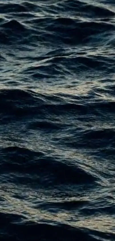 Dark ocean waves wallpaper for mobile phone with serene and calming vibe.