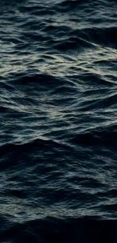 Dark ocean waves mobile wallpaper with a moody atmosphere.