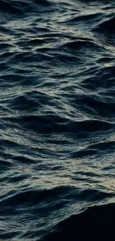 Dark ocean waves creating a calm and serene mobile wallpaper.