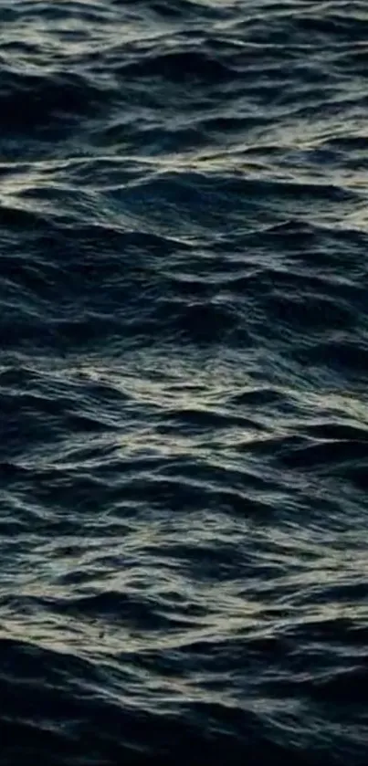 Dark ocean waves creating a serene mobile wallpaper.