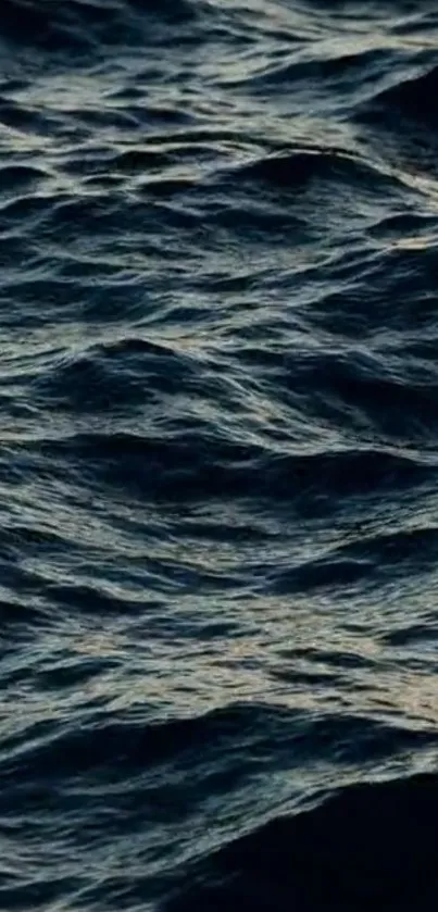 Dark blue ocean waves rolling with natural texture.