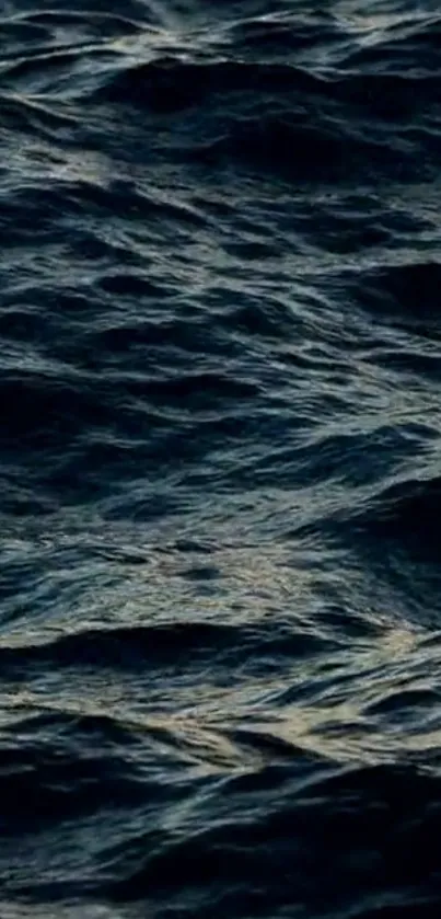 Dark ocean waves creating a calming and mysterious mobile wallpaper background.