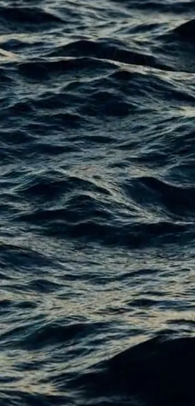 Dark ocean waves forming a serene and textured pattern.