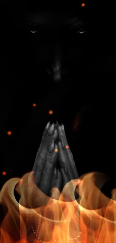 Dark wallpaper with praying hands in shadows.