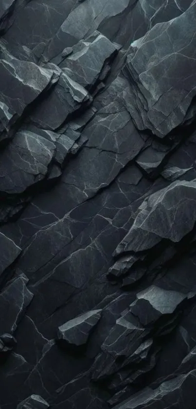 Dark textured rock wallpaper with intricate patterns.