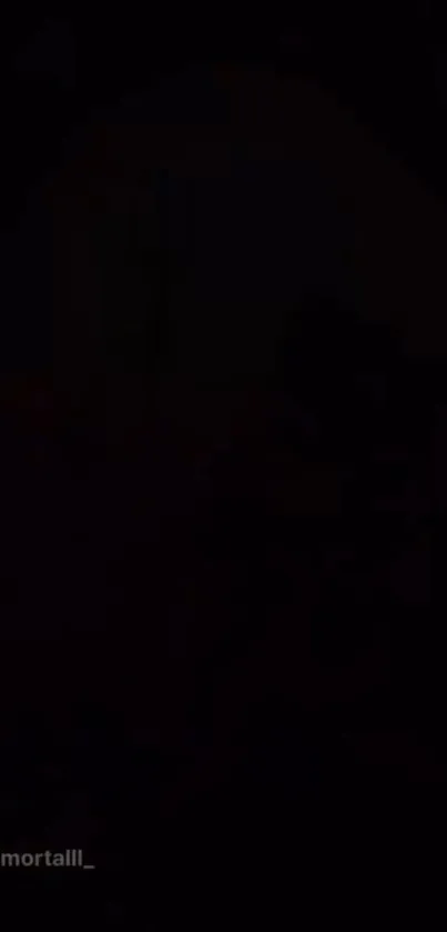 Dark silhouette with mysterious shadowy figure on a mobile wallpaper.