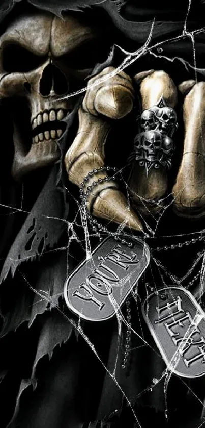 Dark gothic skeleton hand holding tags on a mobile wallpaper.