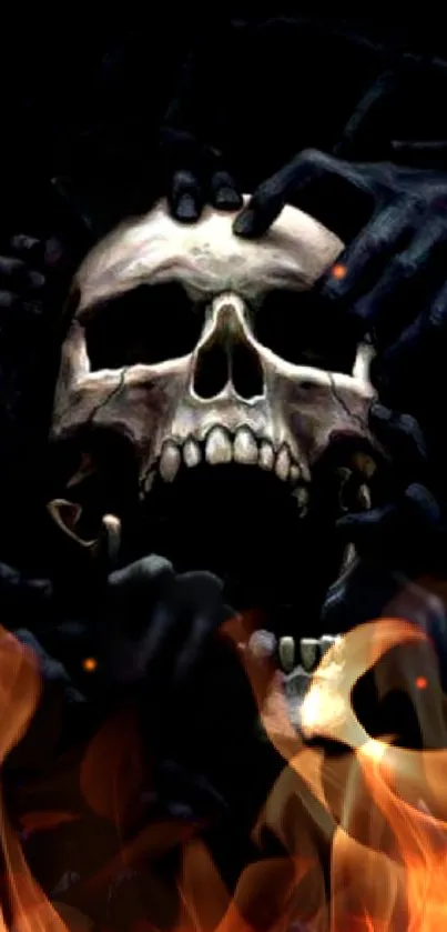 Eerie skull engulfed in flames with dark hands.