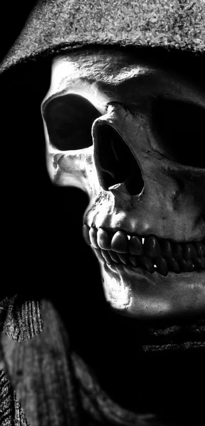 Dark skull in a hood with black background for mobile wallpaper.