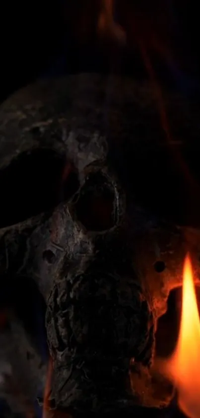 A dark skull surrounded by orange flames, creating a mysterious effect.