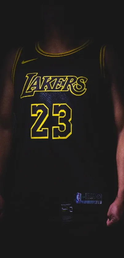 Dark basketball jersey with yellow highlights on a black background.