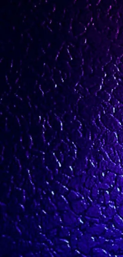 Dark textured purple wallpaper with elegant patterns.