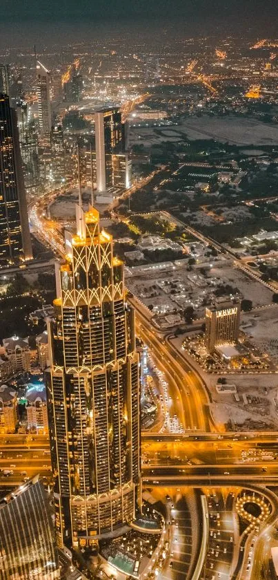 Aerial view of city skyscrapers at night with illuminated roads.