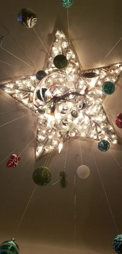 Star-shaped ceiling light with festive ornaments.