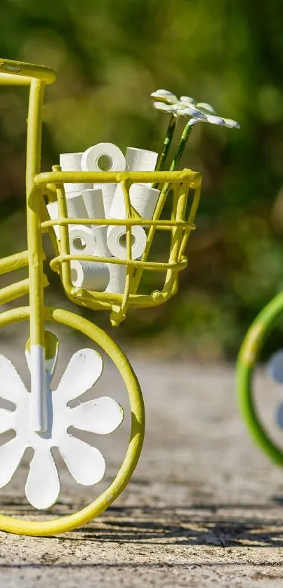 Artistic miniature bicycles with a nature backdrop.