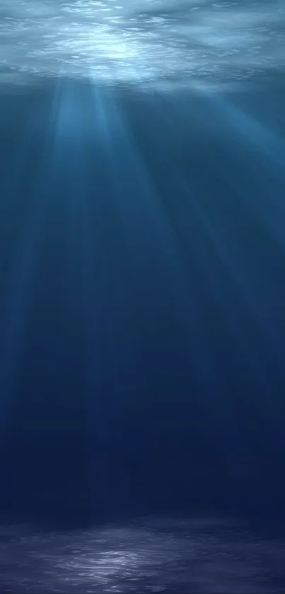 Deep blue ocean with light rays filtering through water.