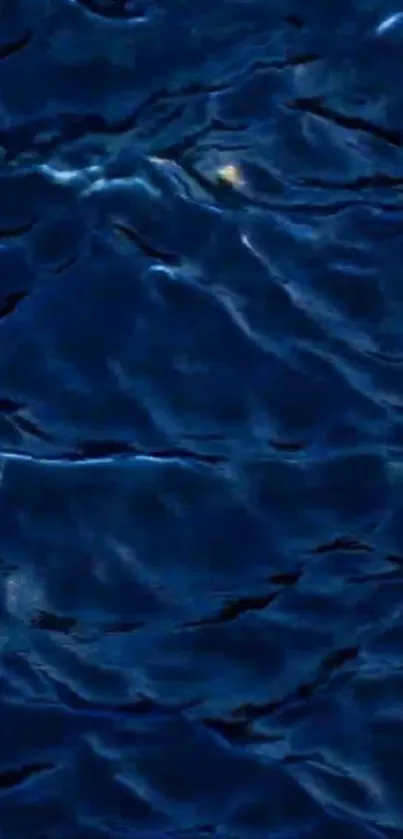 Deep blue ocean waves create a tranquil phone wallpaper.