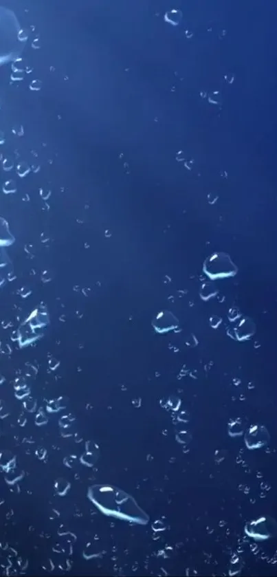 Deep blue wallpaper with water drops cascading effect.