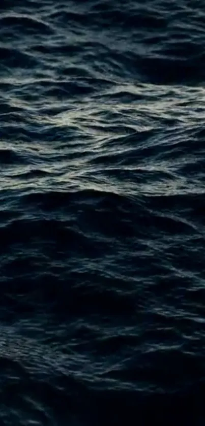 A calming mobile wallpaper of deep blue ocean waves.