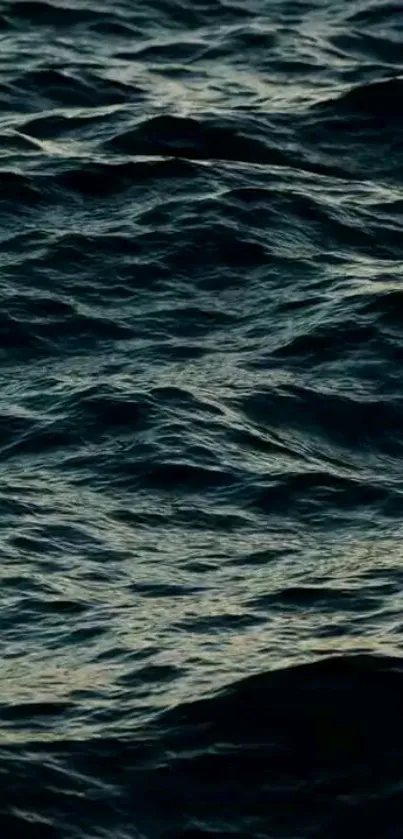 Mobile wallpaper of dark ocean waves in deep blue.