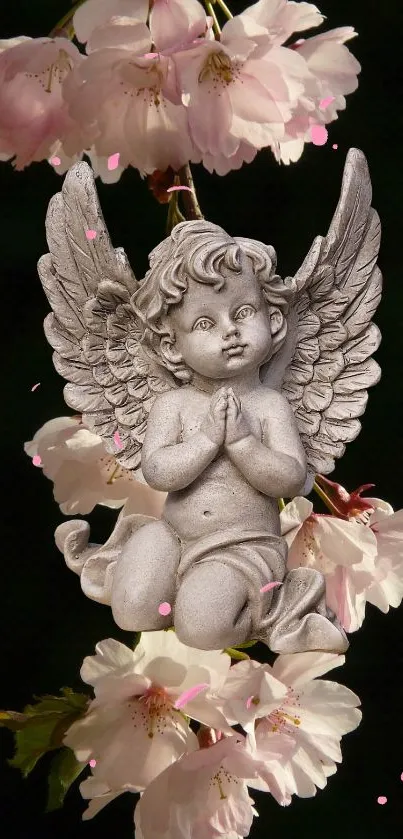 Angel statue amidst cherry blossoms in serene wallpaper.