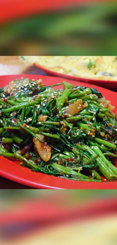 Colorful Asian stir-fry on red plate with fresh greens.