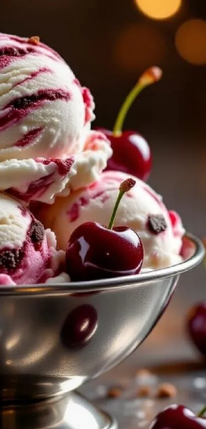 Cherry ice cream scoops in a silver bowl with vibrant cherries.