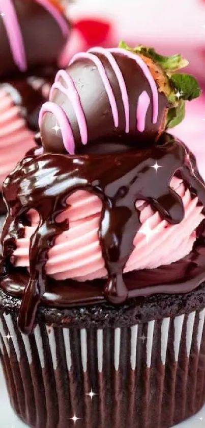 Chocolate cupcake with pink frosting and strawberries.