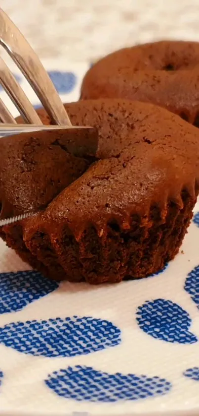 Chocolate cupcakes on a decorative plate.