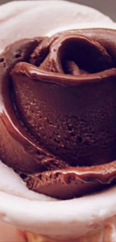 Chocolate ice cream rose on a cone.
