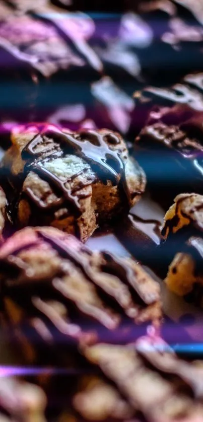 Close-up of chocolate-draped treats on a vivid mobile wallpaper.