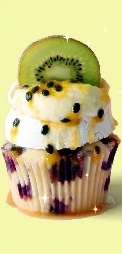 Cupcake topped with kiwi slice on pastel background.