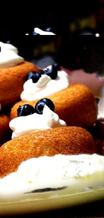A plate of cream-topped desserts with berries.