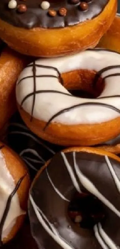 A delightful assortment of chocolate and glazed donuts stacked together.
