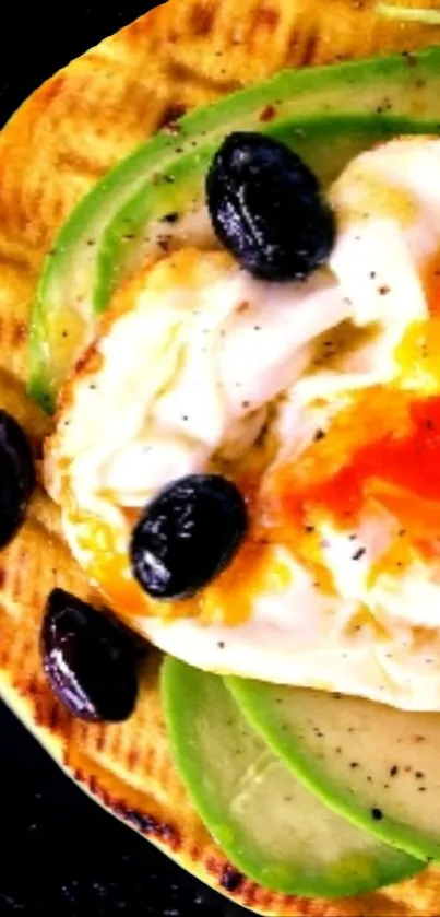 Eggs, avocado, and olives on a black backdrop.