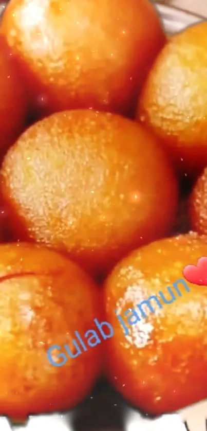 Golden brown Gulab Jamun with a heart emoji and smiley.