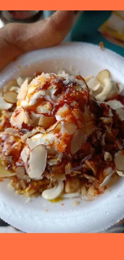 A vibrant ice cream dessert with nuts on a white plate.