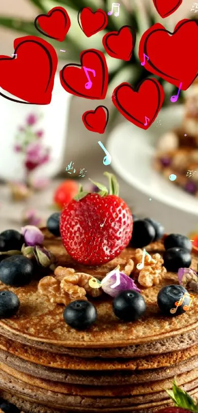 Stack of pancakes topped with fresh berries, walnuts, and edible flowers.