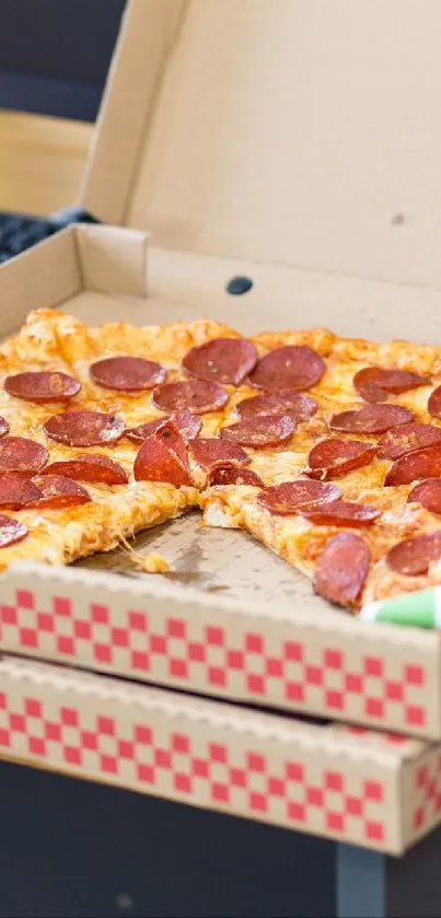 Open pepperoni pizza box on a table.